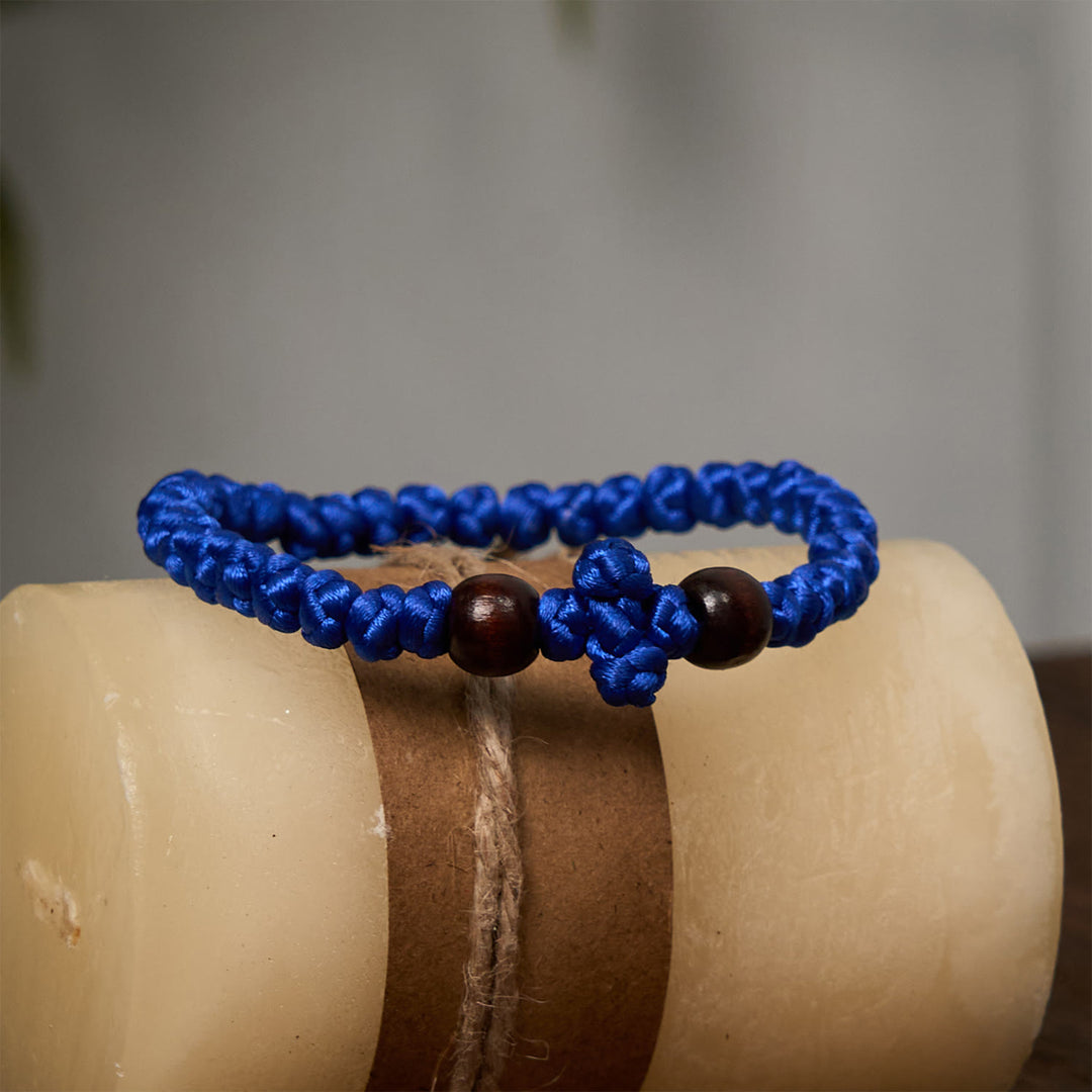 Christianartworkshop Blue & Black Cross - Knot String Bracelet: A Token of Faith