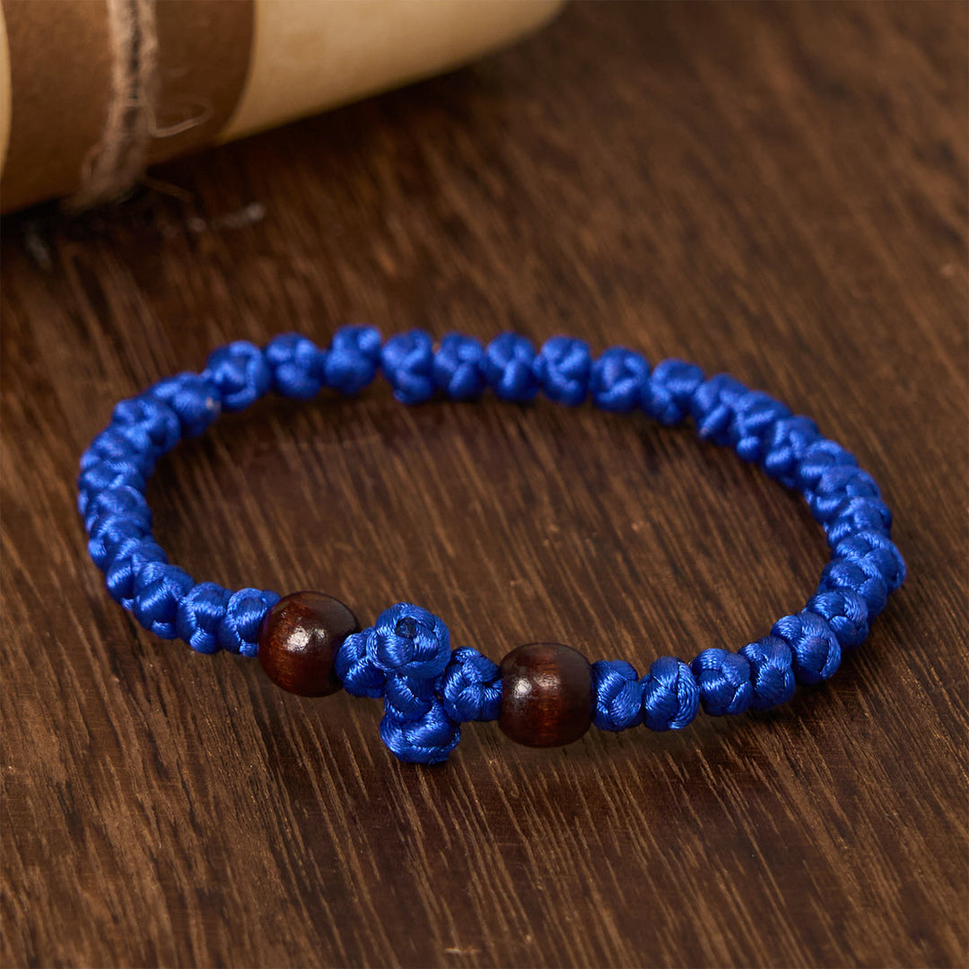 Christianartworkshop Blue & Black Cross - Knot String Bracelet: A Token of Faith