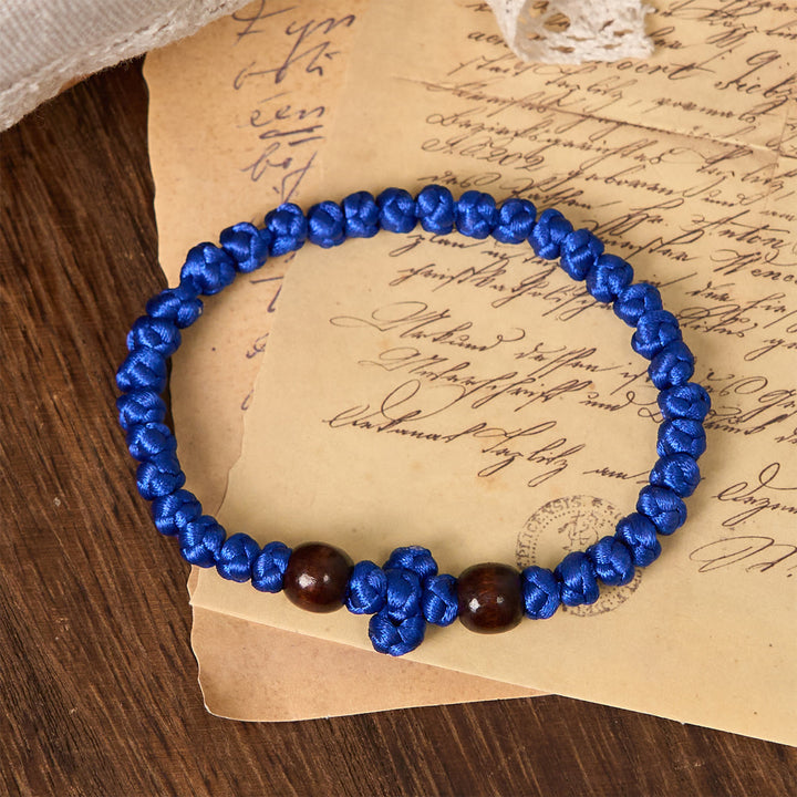 Christianartworkshop Blue & Black Cross - Knot String Bracelet: A Token of Faith