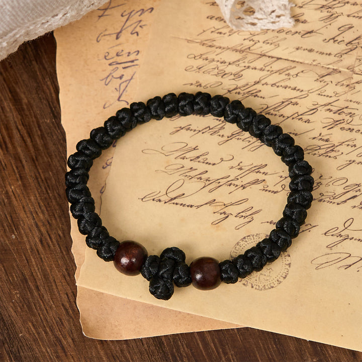 Christianartworkshop Blue & Black Cross - Knot String Bracelet: A Token of Faith