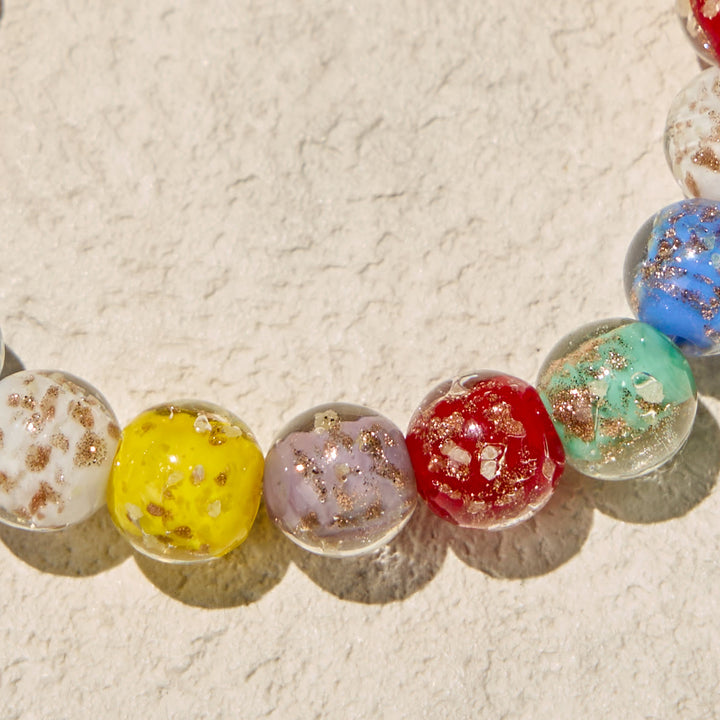 FREE Today: Colorful Glow-in-the-Dark Gold-Flecked Glass Bracelets with Crucifix - image 5