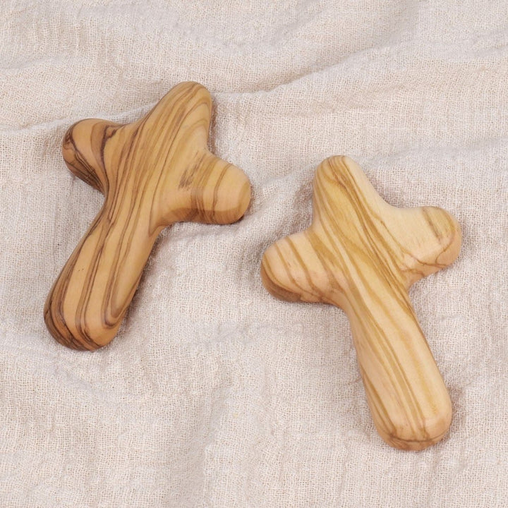 Christianartworkshop Minimalist Olive Wood Handheld Cross: Unique Emblem of Simple Religious Devotion - image 1