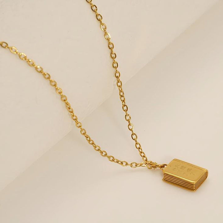 Christianartworkshop Bible Pendant Necklace with Cross Motif: Elevate Your Style with Spiritual Meaning - image 1