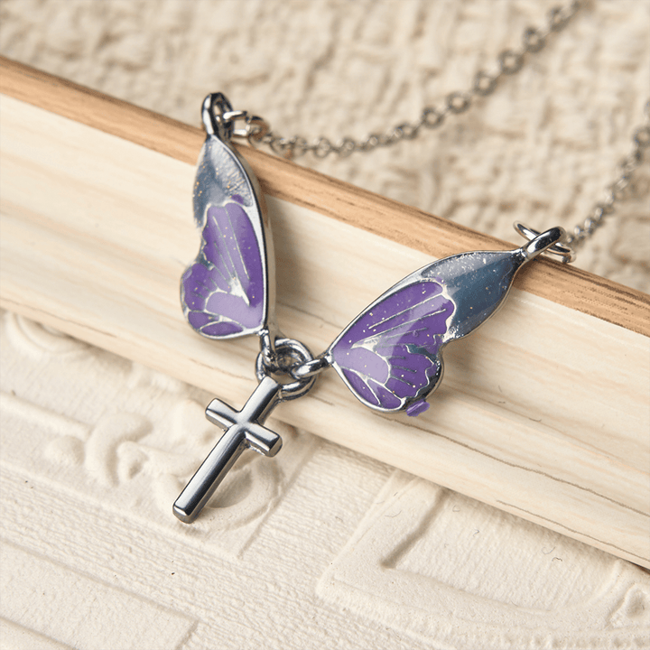 FREE Today: Whimsical Butterfly Wing Cross Pendant Necklace: A Dazzling Symbol of Divine Light and Hope - Butterfly & Cross - image 0