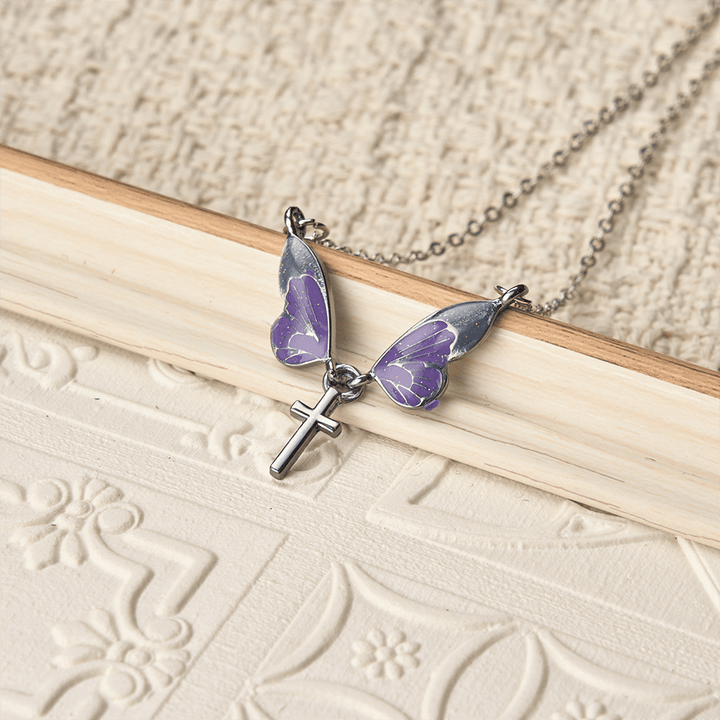 Christianartworkshop Whimsical Butterfly Wing Cross Pendant Necklace: A Dazzling Symbol of Divine Light and Hope - image 1