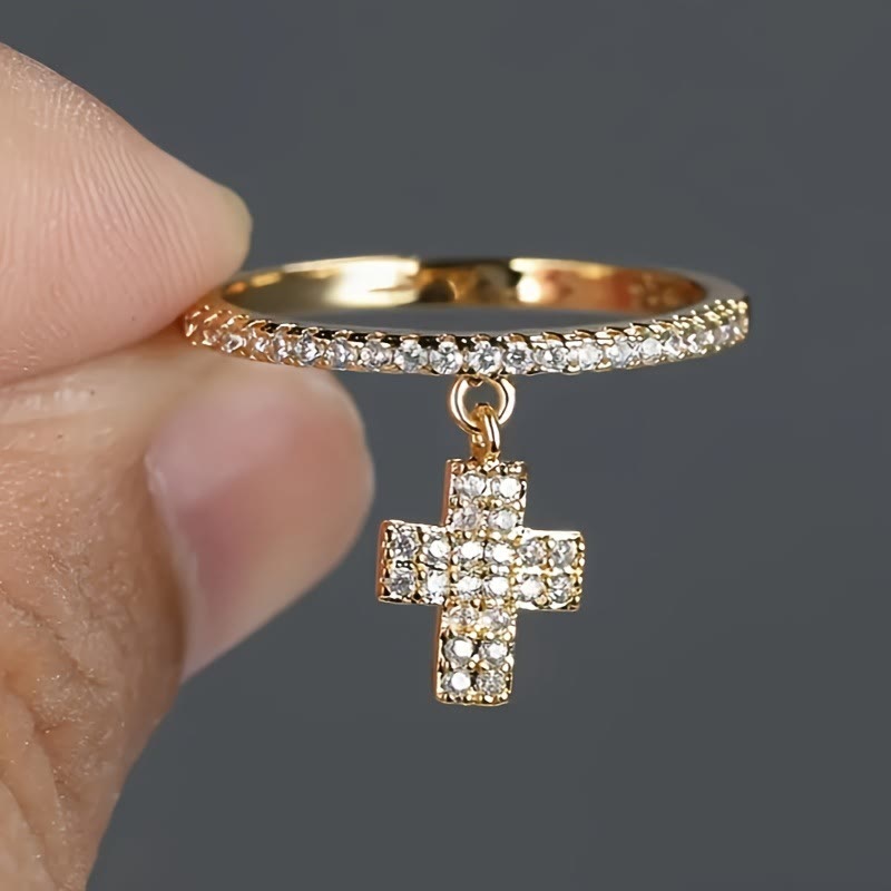 Christianartworkshop Eternity Band Cross Ring with Dangling Zirconia Cross Charm: A Reminder of Divine Light - image 1