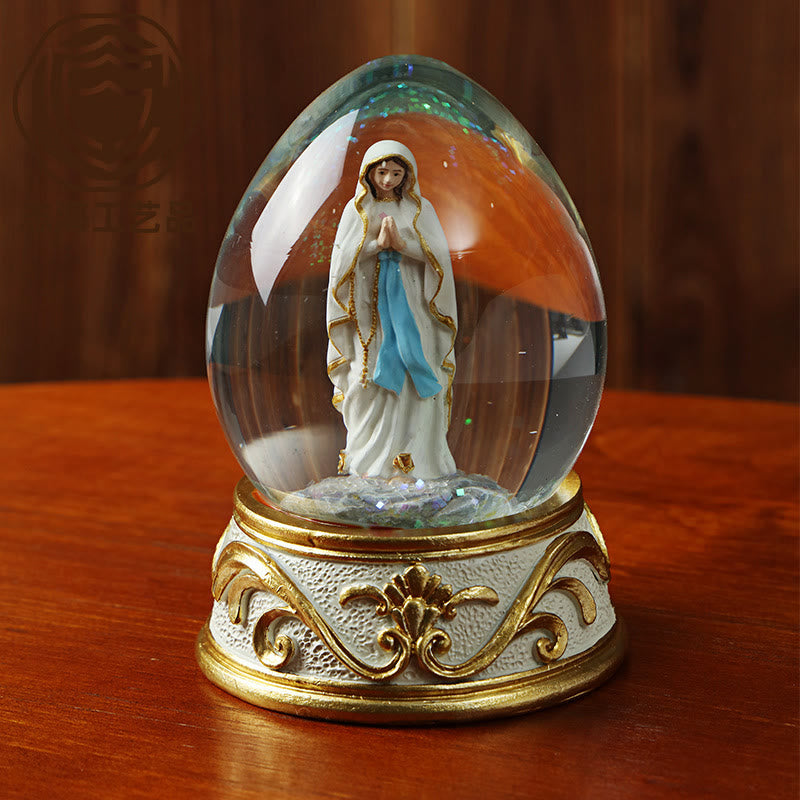 Christianartworkshop Egg Shaped Glitter Snow Globe With Praying Madonna Statue: Emblem of Pure Heavenly Supplication - image 1