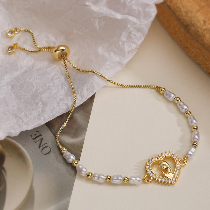 Christianartworkshop Refined Multi‑Style Holy‑Medallion Pearl Bracelet: Icon of Quiet Spiritual Strength for Everyday Wear - Open hollow heart frame - image 2