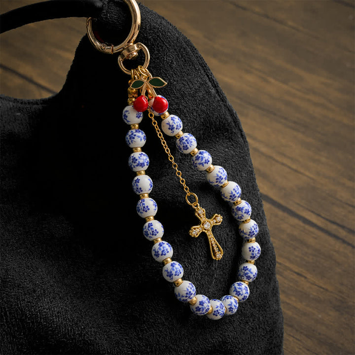 Christianartworkshop Floral Porcelain‑Bead Cherry Accent Bag Charm With Jeweled Cross: Emblem of Gentle Heavenly Grace - Floral Ceramic Cherry Charm - image 0