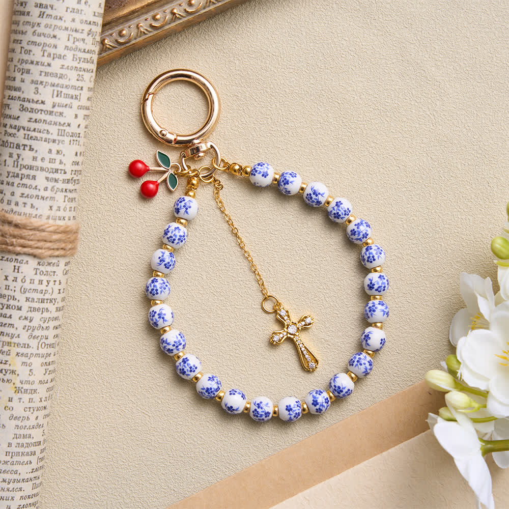 Christianartworkshop Floral Porcelain‑Bead Cherry Accent Bag Charm With Jeweled Cross: Emblem of Gentle Heavenly Grace - image 1