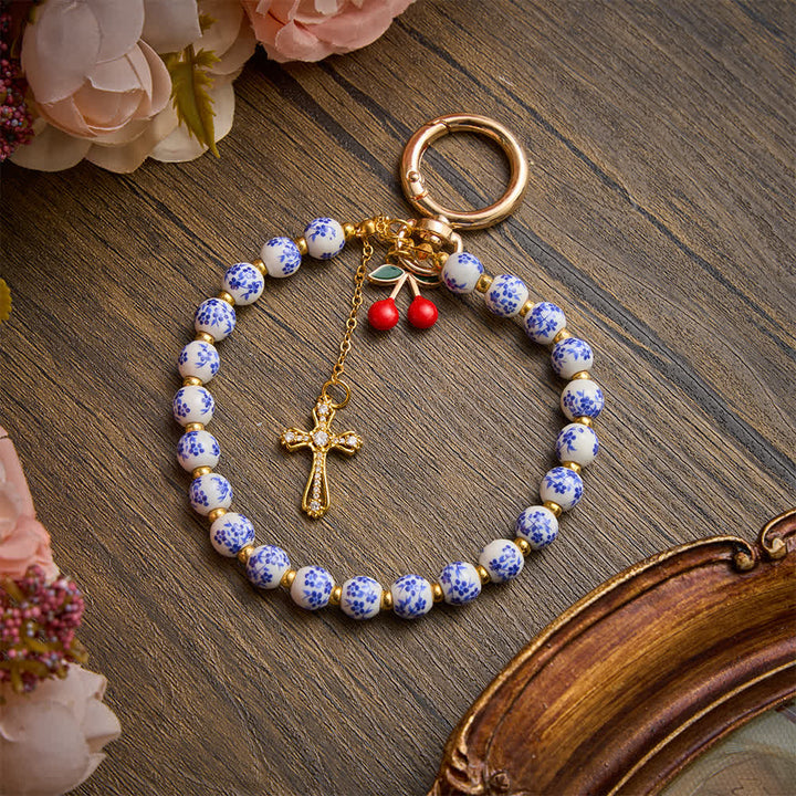 Christianartworkshop Floral Porcelain‑Bead Cherry Accent Bag Charm With Jeweled Cross: Emblem of Gentle Heavenly Grace - image 2