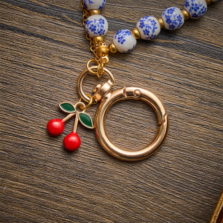 Christianartworkshop Floral Porcelain‑Bead Cherry Accent Bag Charm With Jeweled Cross: Emblem of Gentle Heavenly Grace - image 6
