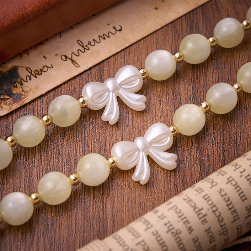 Christianartworkshop Pale Green Cat's Eye Resin Bow Rosary With Gilded Cross: Emblem of Soft Heavenly Grace - image 6