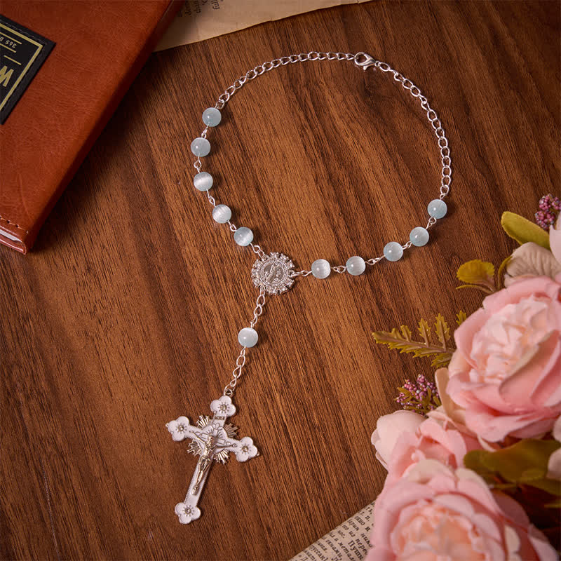 Christianartworkshop Airy Pale Blue Cat's Eye Car Rosary with St. Benedict Medal & White Enamel Crucifix - Light Blue Cat's Eyes Rosary - image 0