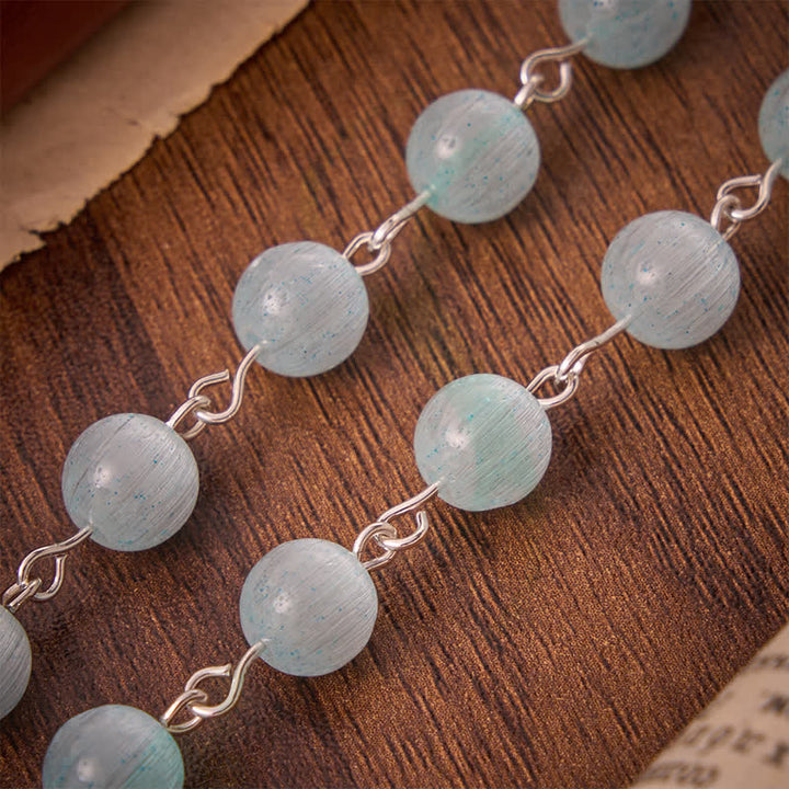 FREE Today: Airy Pale Blue Cat's Eye Car Rosary with St. Benedict Medal & White Enamel Crucifix - image 6